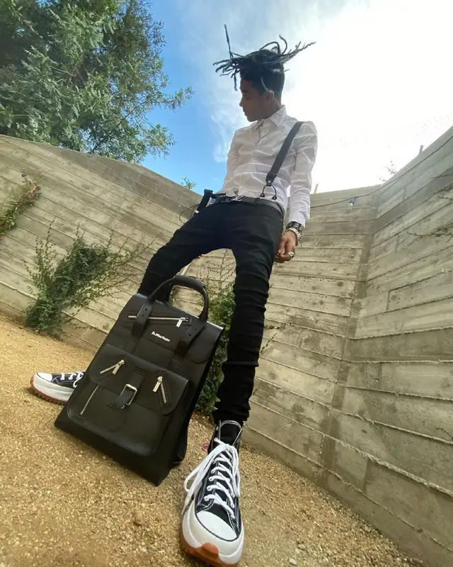 TheHxliday outfit in Saint Laurent, Converse, and Louis Vuitton, 2021