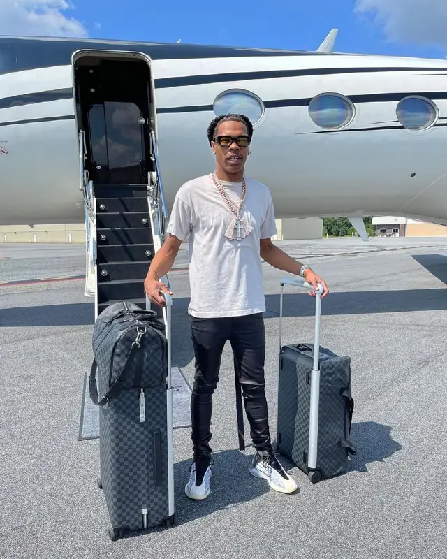 Lil Baby outfit in Amiri, Louis Vuitton, and Off-White, 2021