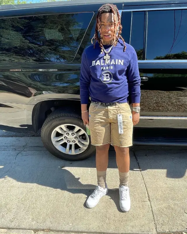 Lil Gotit outfit in Balmain, Purple Brand, and Dior, 2021