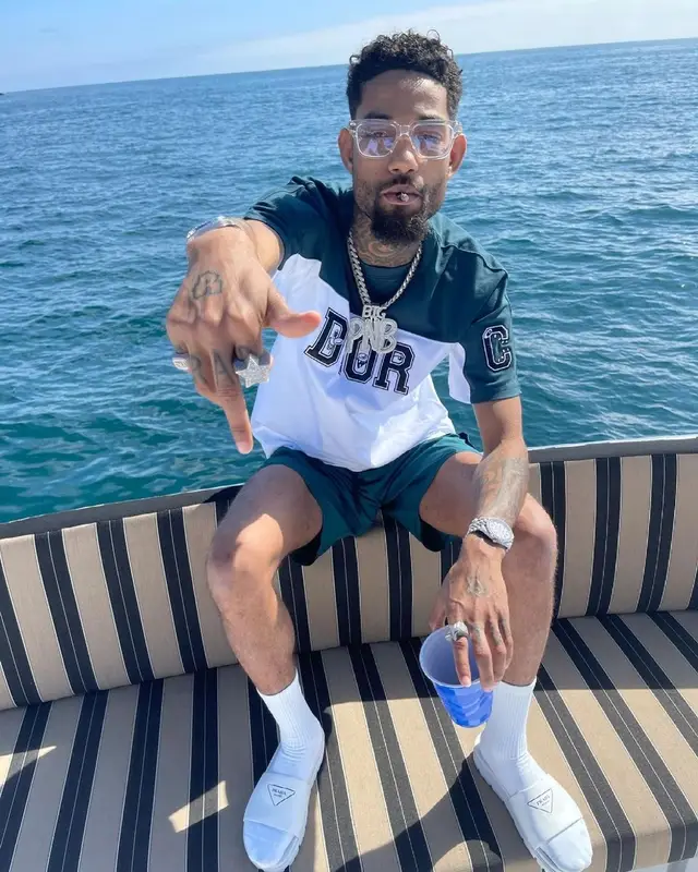 PnB Rock outfit in Dior, Chrome Hearts, and Prada, 2021