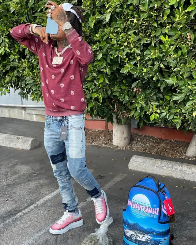 SpotemGottem outfit in Alexander McQueen, CPTL Denim, and Sprayground, 2021