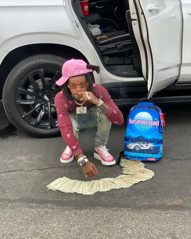 SpotemGottem outfit in Alexander McQueen, Sprayground, and Cartier, 2021