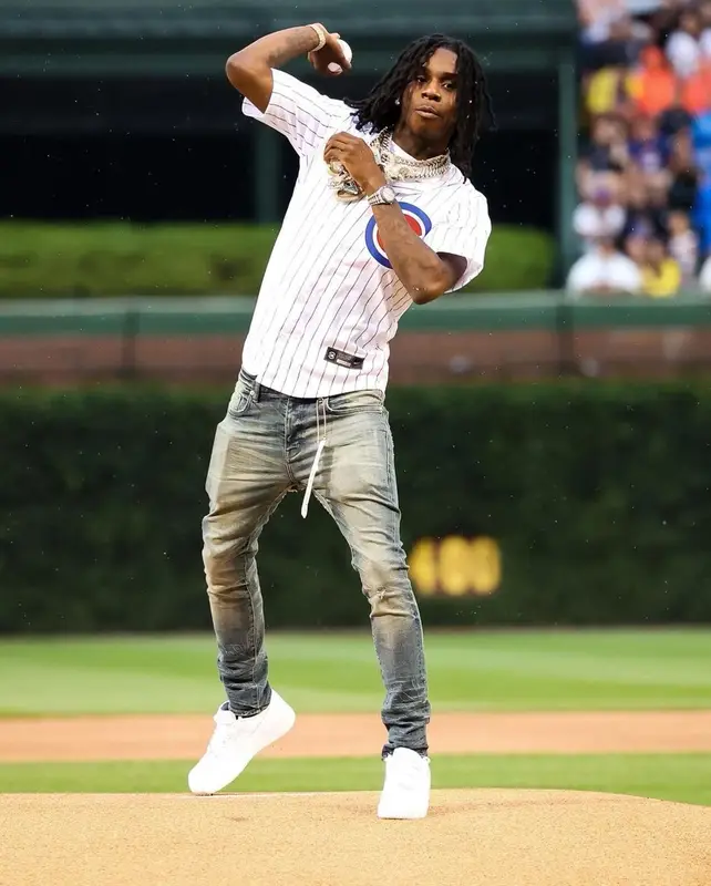 Polo G outfit in Nike, Purple Brand, and Rawlings, 2021