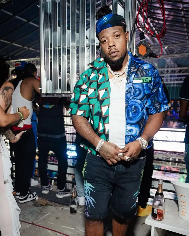 Rowdy Rebel outfit in Amiri, Prada, and Louis Vuitton, 2021