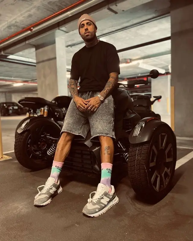Nicky Jam outfit in New Balance, Kith, and Gallery Dept., 2021