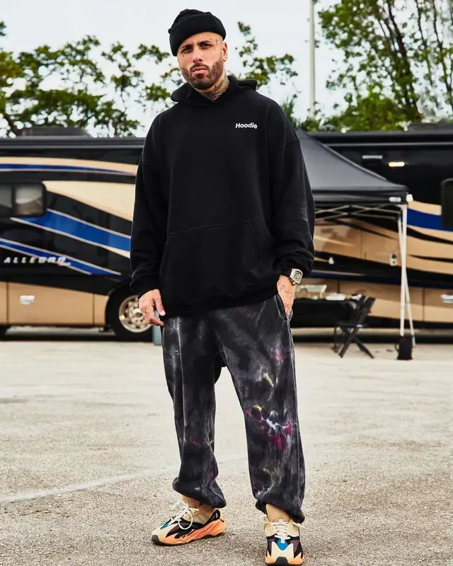 Nicky Jam outfit in Vetements, Alexander McQueen, and Adidas, 2021