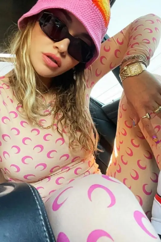 Rita Ora outfit in Cartier, Prada, and Emily Levine, 2021