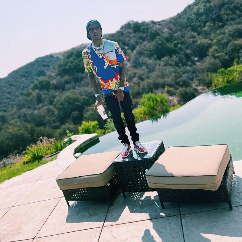 Soulja Boy outfit in Versace, Amiri, and Louis Vuitton, 2021