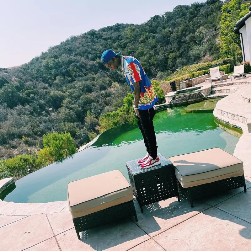 Soulja Boy outfit in Versace, Amiri, and Louis Vuitton, 2021
