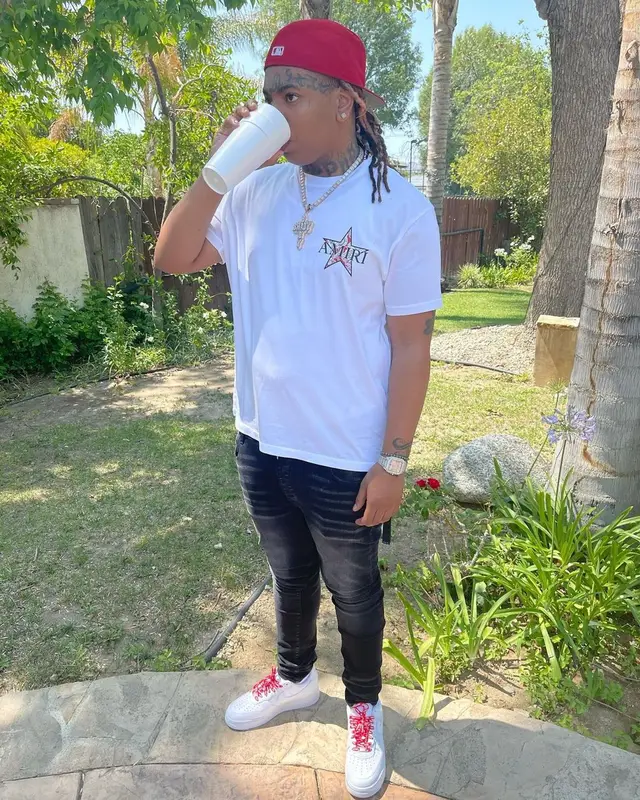 Lil Gotit outfit in Amiri, Supreme, and New Era, 2021