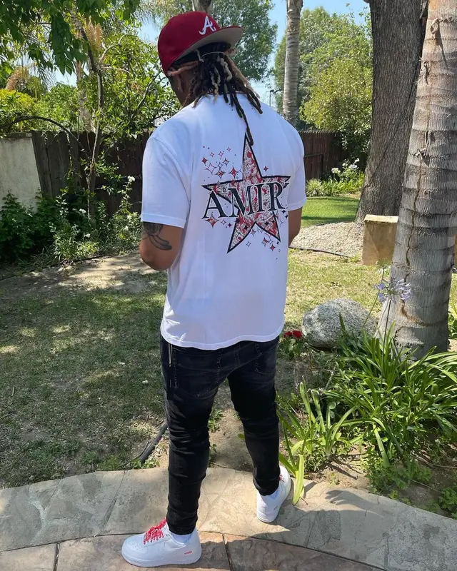Lil Gotit outfit in Amiri, Supreme, and New Era, 2021