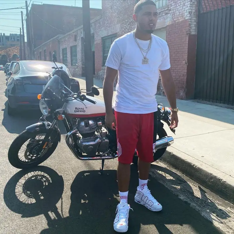 Myke Towers outfit in Mitchell & Ness, Nike, and Burberry, 2021