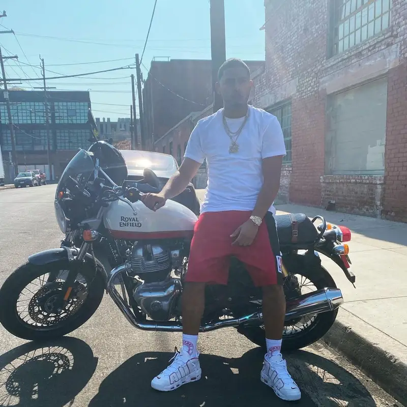 Myke Towers outfit in Mitchell & Ness, Nike, and Burberry, 2021