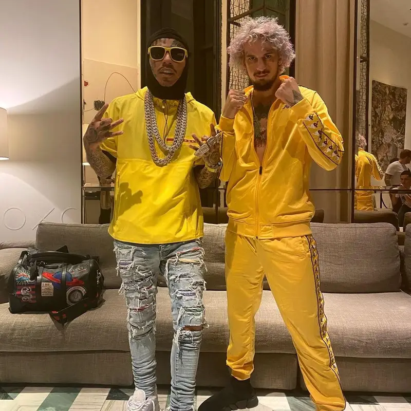 6ix9ine outfit in Amiri, Versace, and Prada, 2021