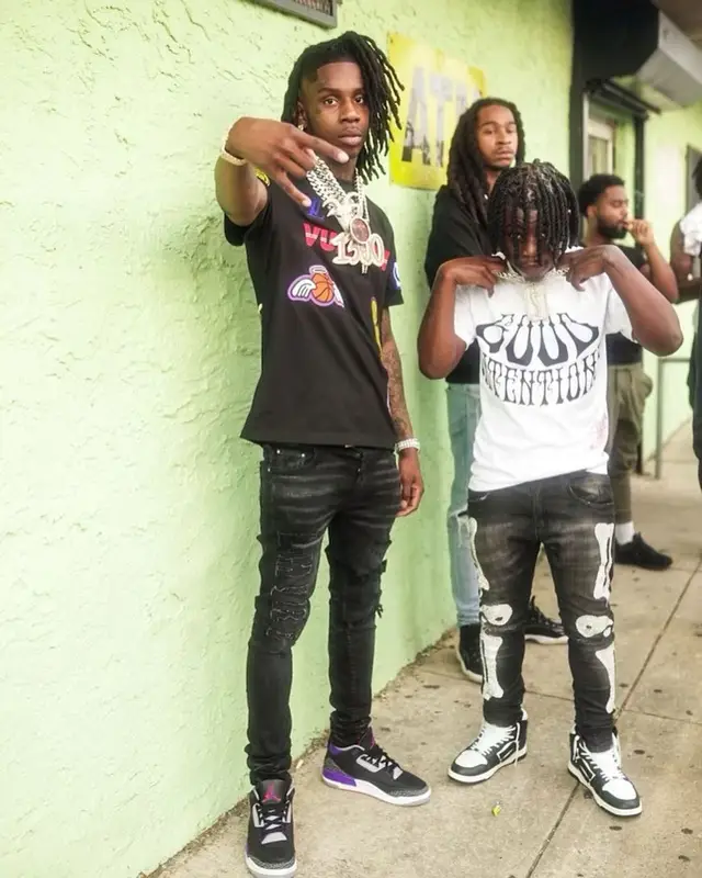 Polo G outfit in Louis Vuitton, Amiri, and NBA, 2021