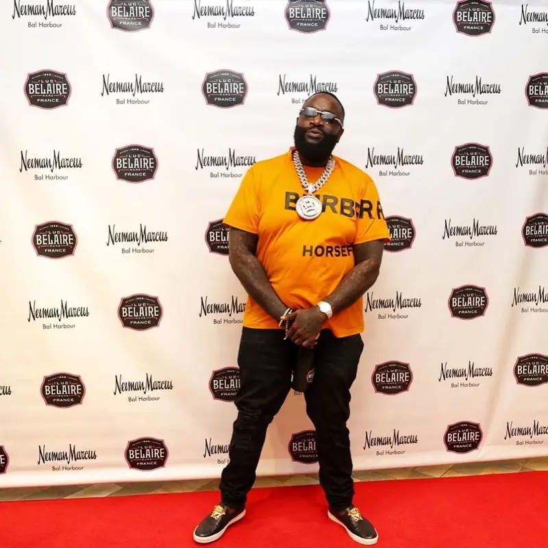 Rick Ross outfit in Burberry, Versace, and Cartier, 2021