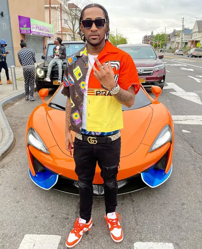 Ron Suno outfit in Prada, Gucci, and Louis Vuitton, 2021