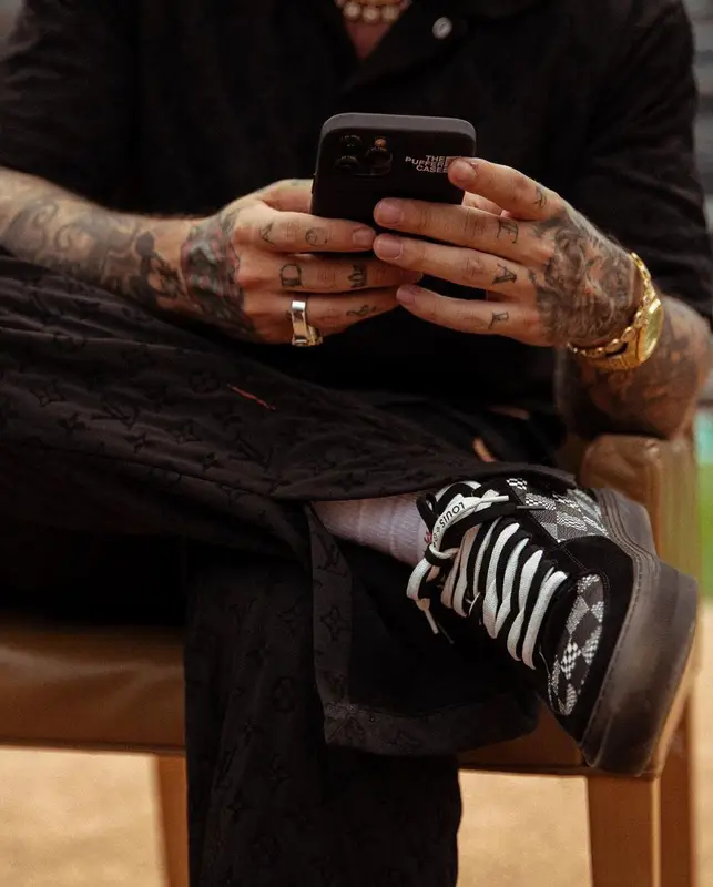 J Balvin outfit in Louis Vuitton, Prada, and NBA, 2021