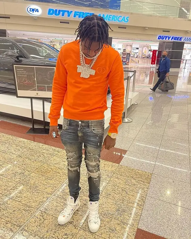Lil Tjay outfit in Dior, Amiri, and Kenny Scharf, 2021