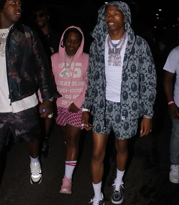 Lil Baby outfit in Bape, Polo Ralph Lauren, and Coach, 2021