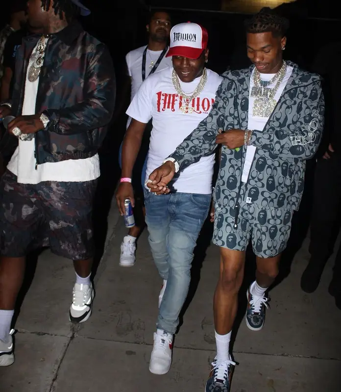 Lil Baby outfit in Bape, Polo Ralph Lauren, and Coach, 2021