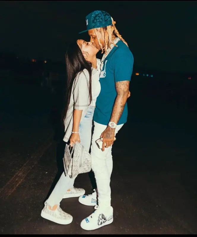Lil Durk outfit in Amiri, Nike, and Louis Vuitton, 2021