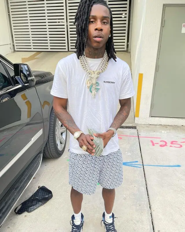 Polo G outfit in Burberry, Nike, and Louis Vuitton, 2021