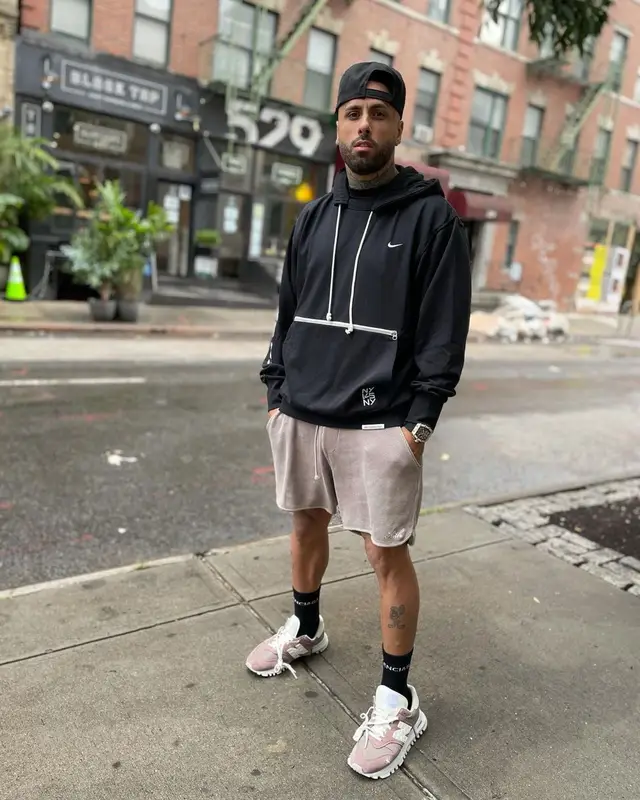 Nicky Jam outfit in Nike, Kith, and Balenciaga, 2021