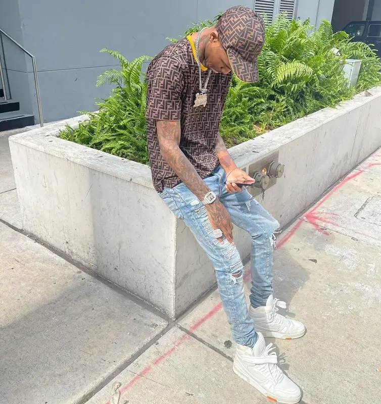 Lil Reese outfit in Amiri, Louis Vuitton, and Fendi, 2021