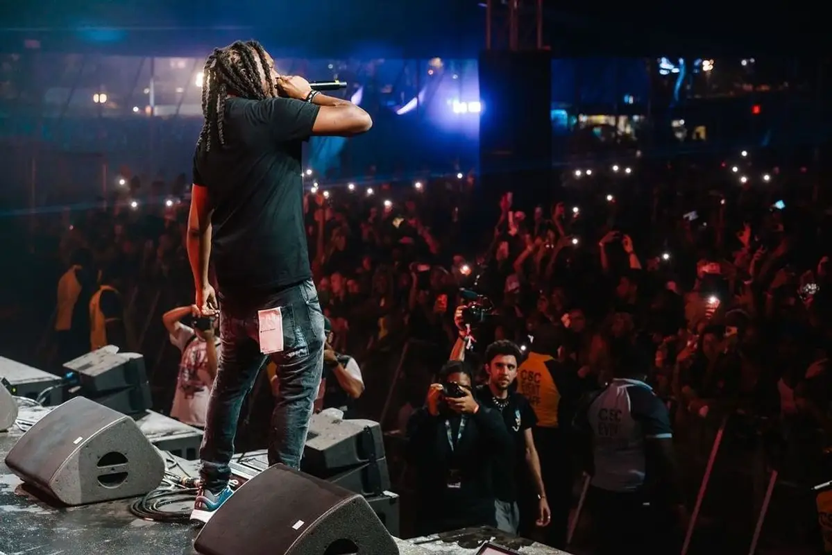 Young Nudy outfit in Burberry, Purple Brand, and Dior, 2021