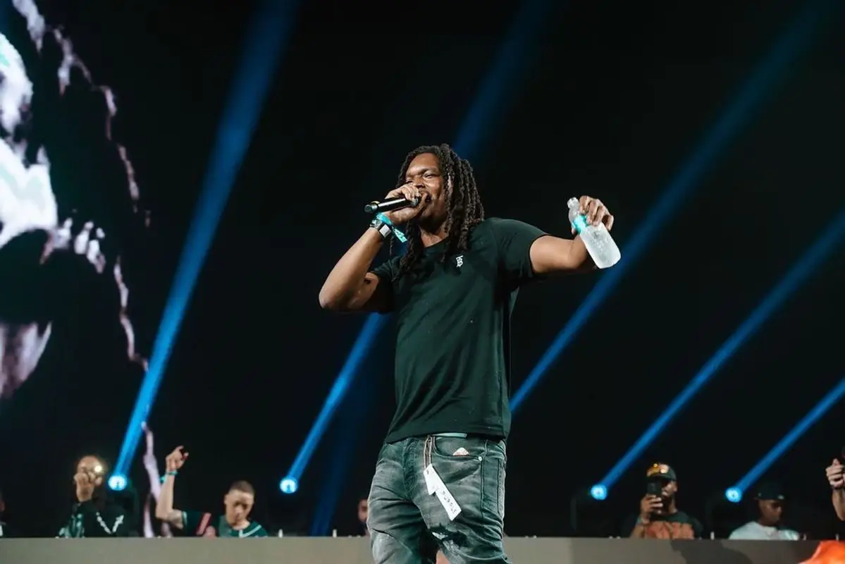 Young Nudy outfit in Burberry, Purple Brand, and Dior, 2021