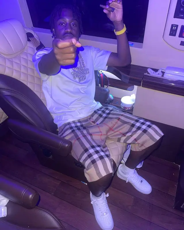 Lil Tjay outfit in Hanes, Burberry, and Nike, 2021