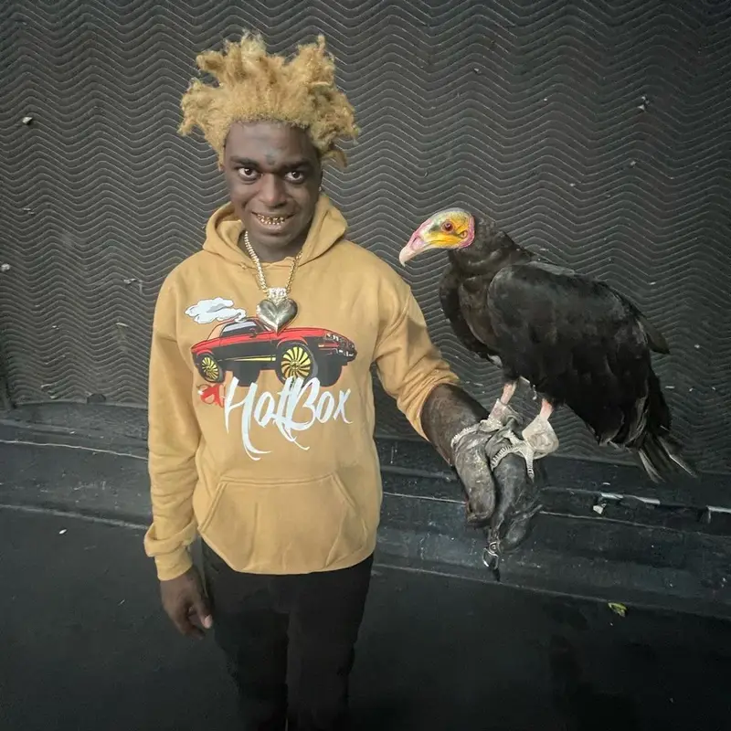 Kodak Black outfit in Sniper Gang Apparel, Amiri, and Fritos, 2021