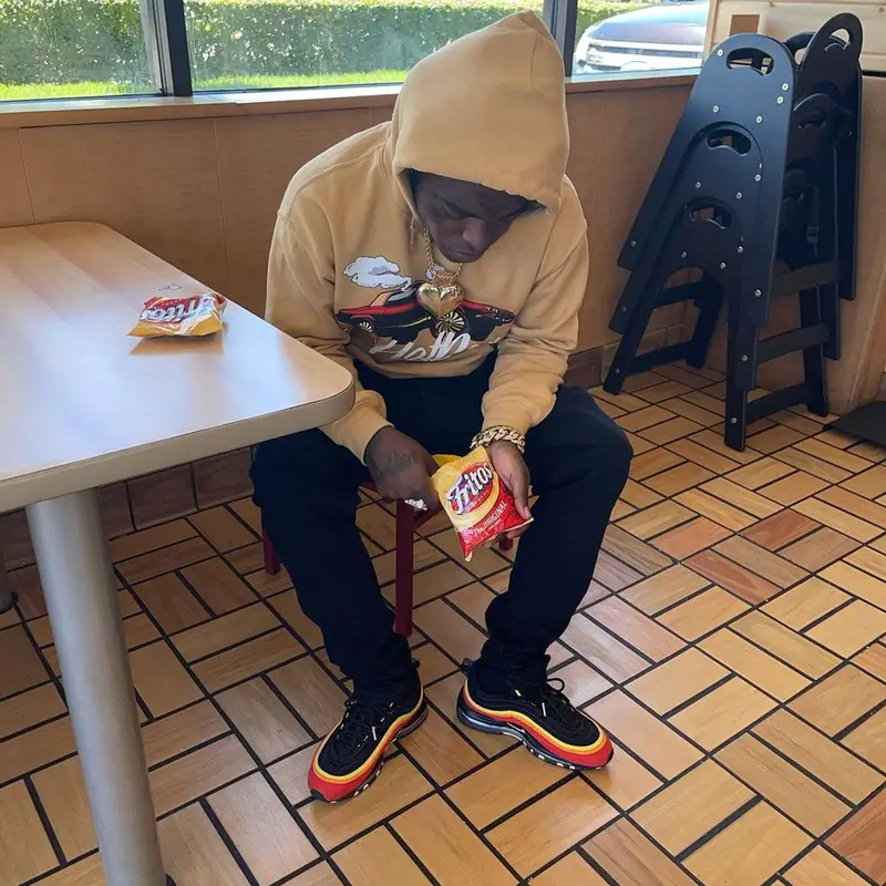 Kodak Black outfit in Sniper Gang Apparel, Amiri, and Fritos, 2021
