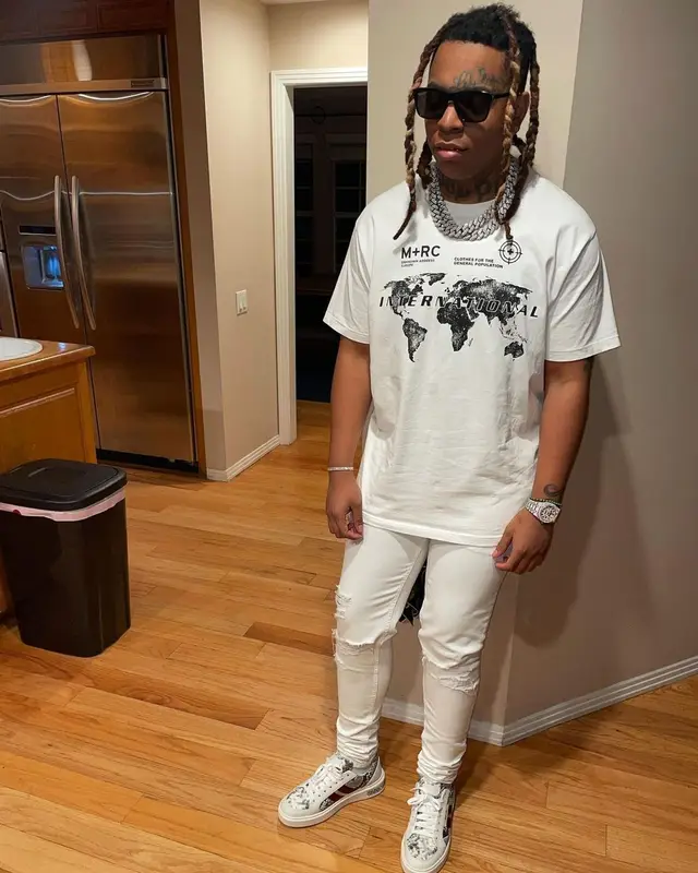 Lil Gotit outfit in M+RC Noir, Amiri, and Bally, 2021
