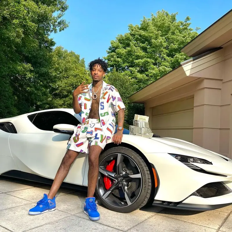21 Savage outfit in Louis Vuitton, NBA, and Hanes, 2021