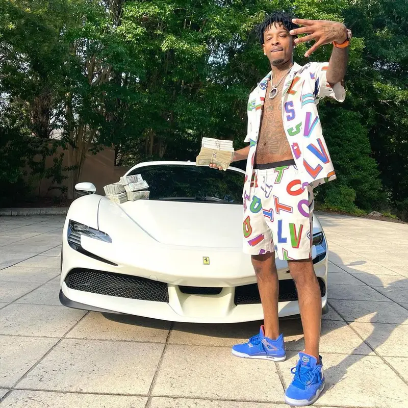21 Savage outfit in Louis Vuitton, NBA, and Hanes, 2021
