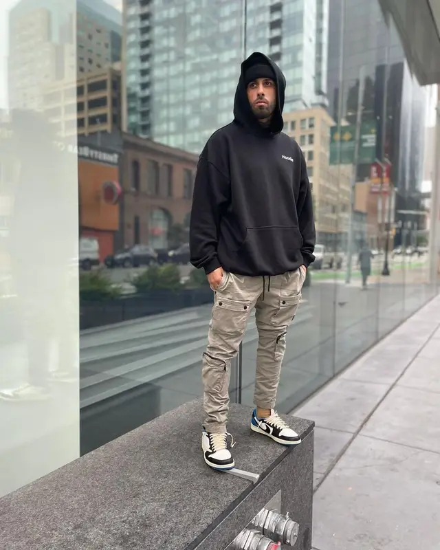 Nicky Jam outfit in Vetements, Nike, and Travis Scott Merch, 2021
