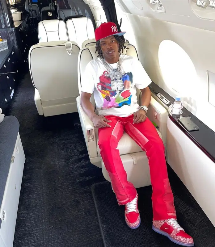Lil Baby outfit in Gallery Dept., Nike, and New Era, 2021
