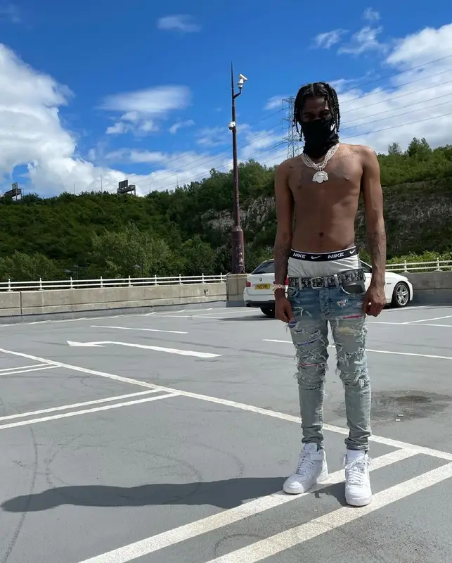 Russ Millions outfit in Dior, Amiri, and Louis Vuitton, 2021