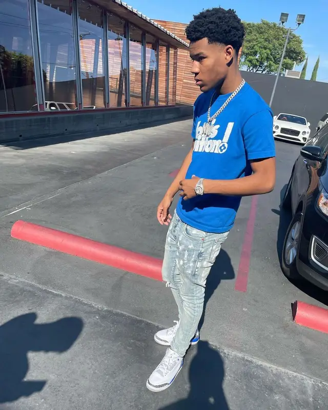 Nardo Wick outfit in Louis Vuitton, Purple Brand, and Jordan, 2021