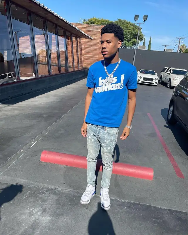 Nardo Wick outfit in Louis Vuitton, Purple Brand, and Jordan, 2021