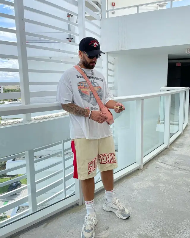 Feid outfit in Supreme, Dior, and Hanes, 2021