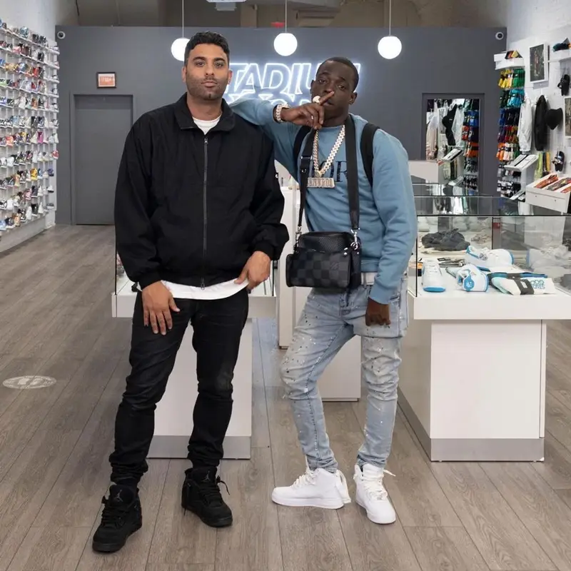 Bobby Shmurda outfit in Dior, Purple Brand, and Louis Vuitton, 2021