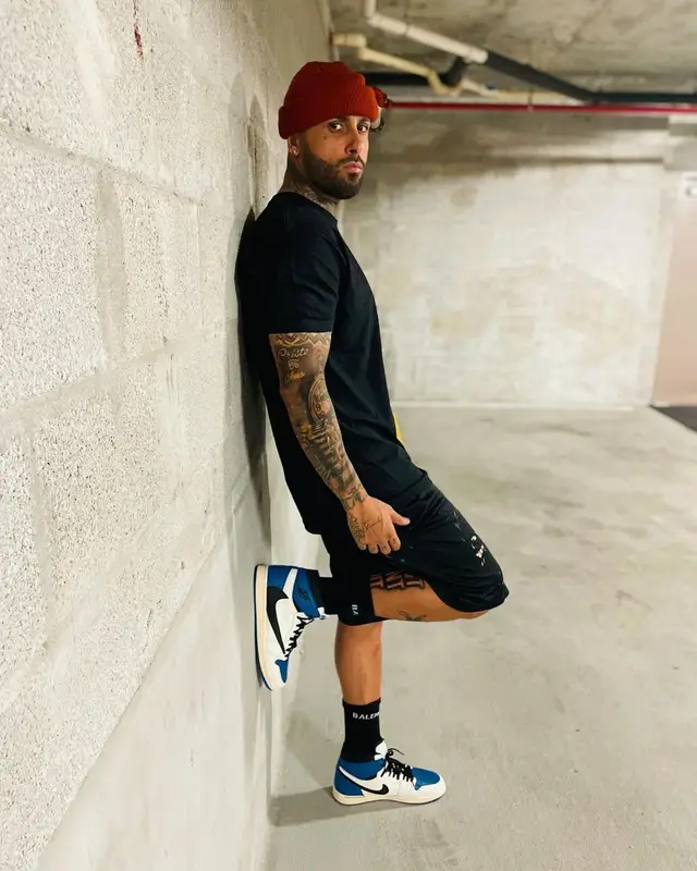 Nicky Jam outfit in Gallery Dept., Nike, and Balenciaga, 2021