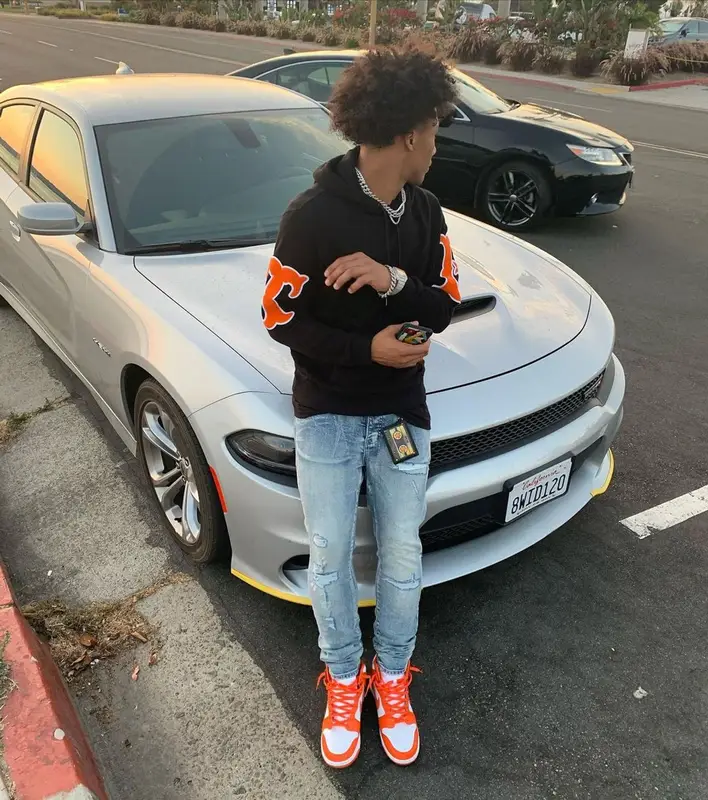 Mikey outfit in Travis Scott Merch, Burberry, and MCM, 2021