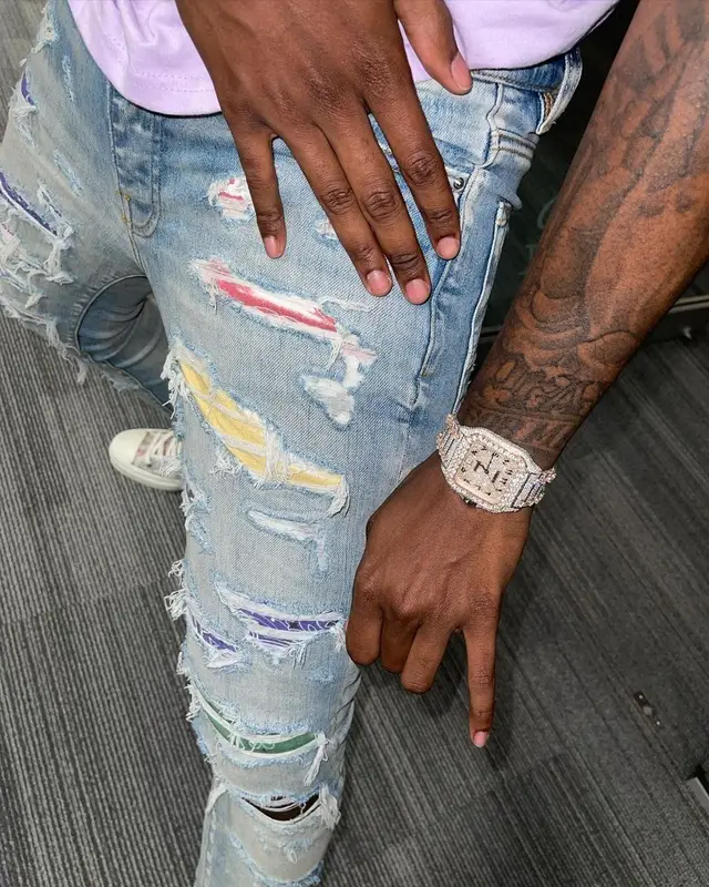 Toosii outfit in PacSun, Cartier, and New Era, 2021