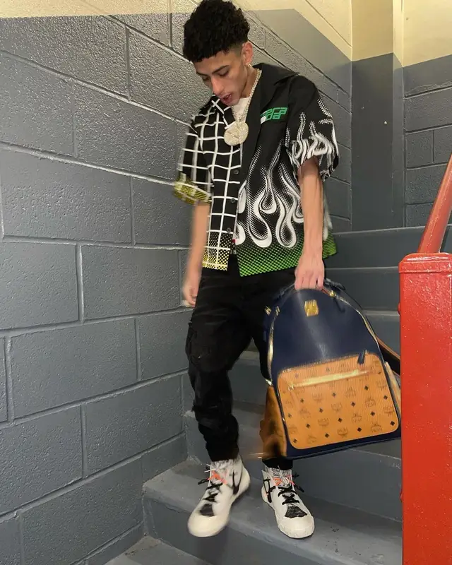 J.I. outfit in Prada, Amiri, and Nike, 2021
