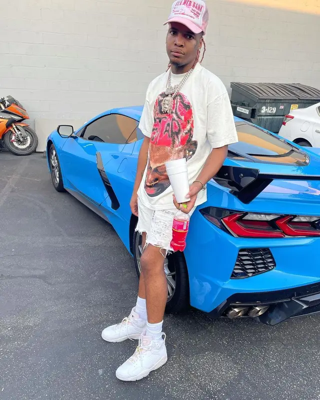Lil Keed outfit in Purple Brand, Jordan, and Spider Worldwide, 2021