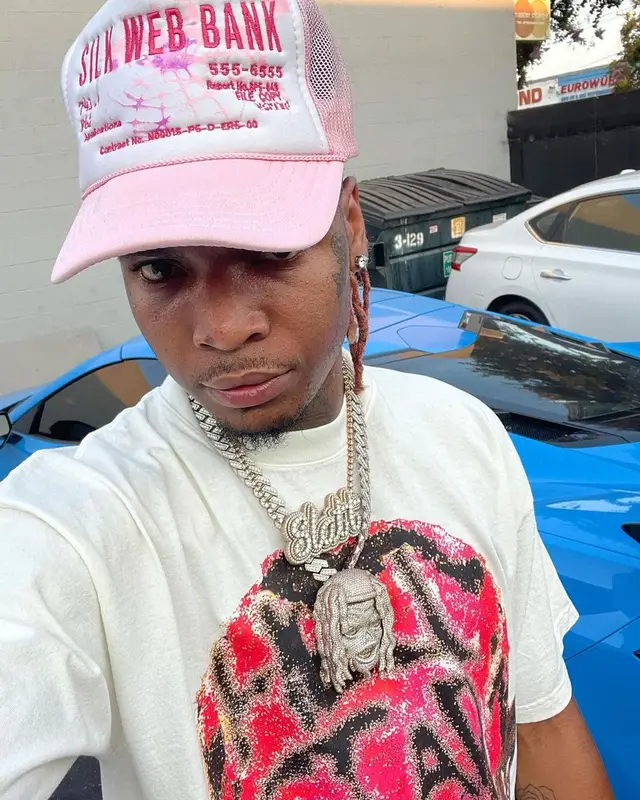 Lil Keed outfit in Purple Brand, Jordan, and Spider Worldwide, 2021